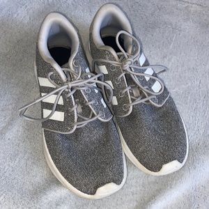 Woman’s gray addidas sneakers